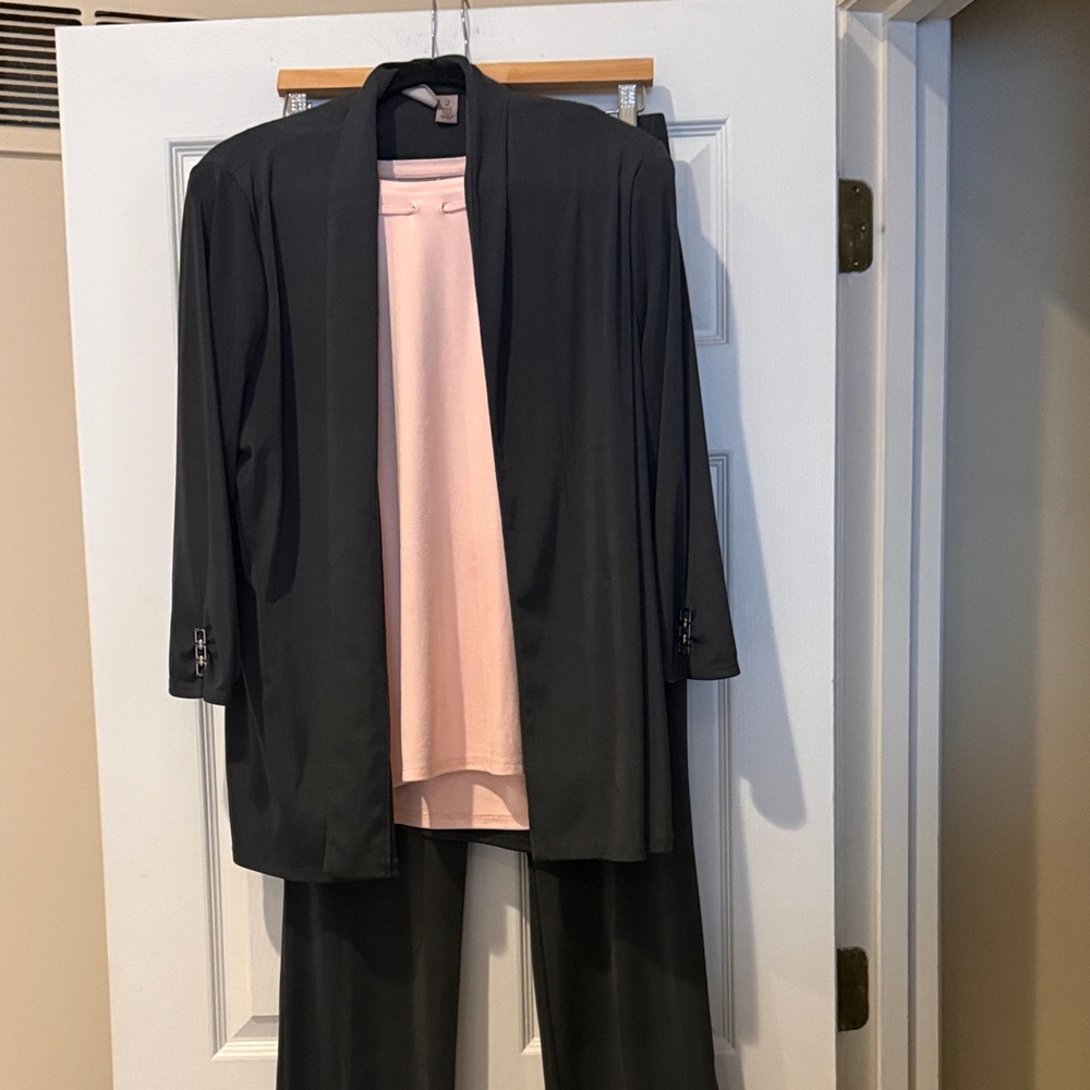 Dark gray pants and jacket with pink short sleeve shirt